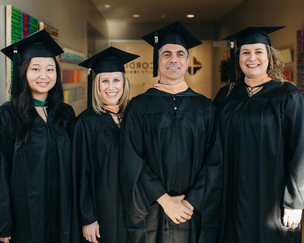 MBA graduates in their cap and gowns